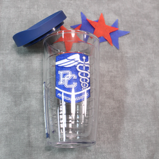Product Photo of a 16 oz tervis tumbler with a royal and white PC Physician's Assistant Patch between the double walls. The royal blue lid is off in this photo and 4 red and blue stars are near the top of the cup.