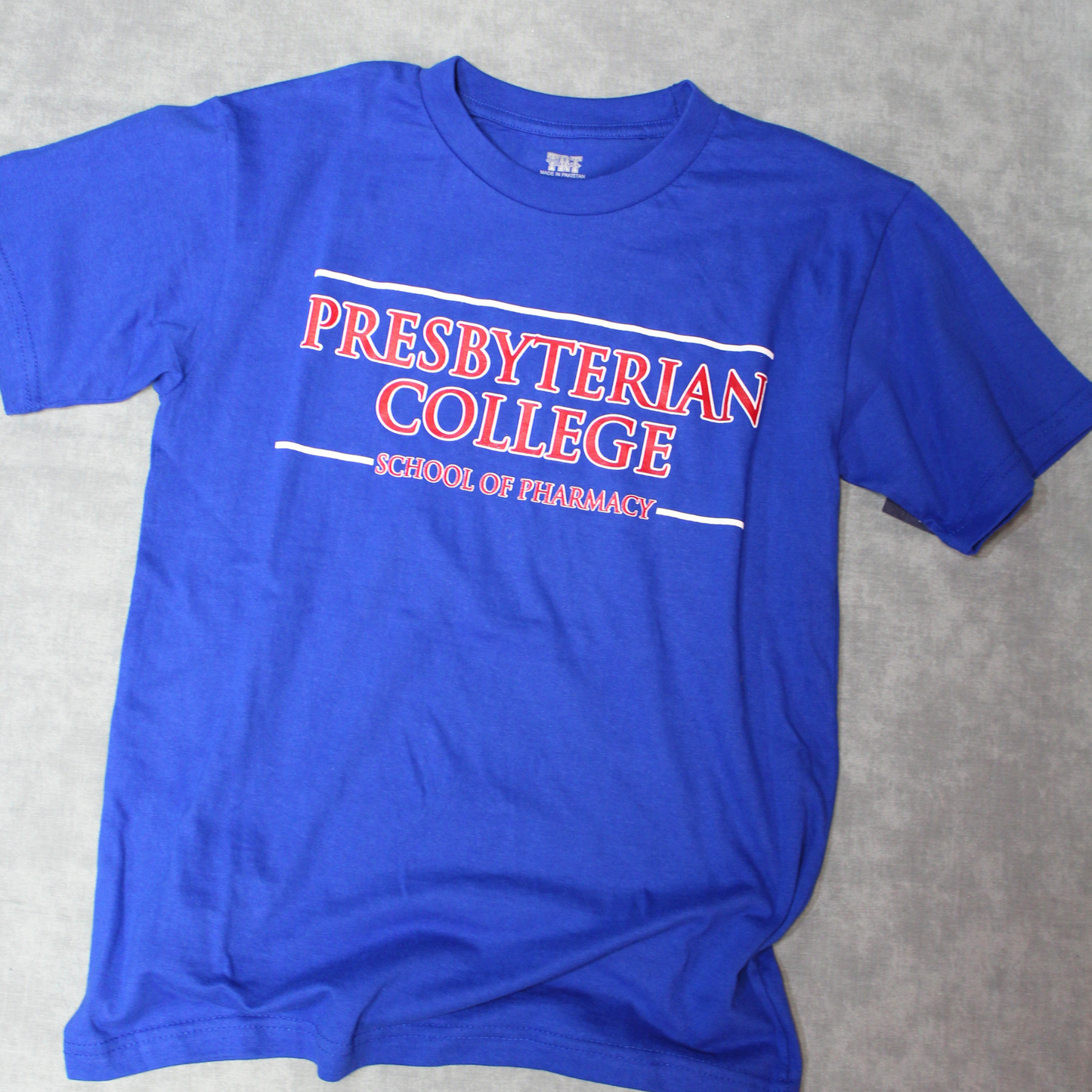 Royal blue t-shirt with red and white graphic Presbyterian College School of Pharmacy
