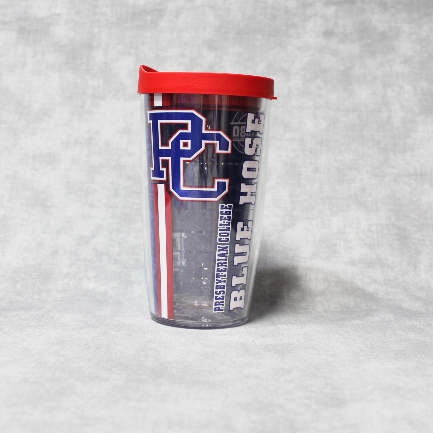 Tervis tumbler 16oz with a block PC logo, Presbyterian College, and Blue Hose printed on it in white, blue, and red inks. The cup features a red lid.