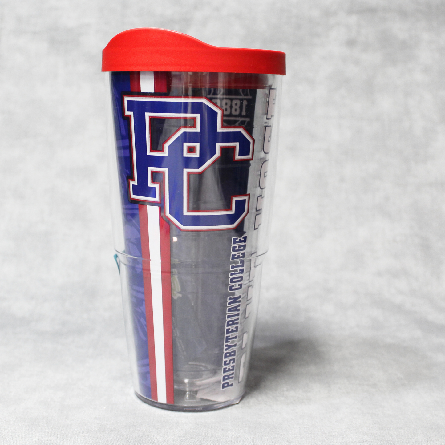Picture of a 24 oz Tervis Tumbler with a red lid that features the PC logo, Presbyterian College, Blue Hose in blue, red, and white ink.