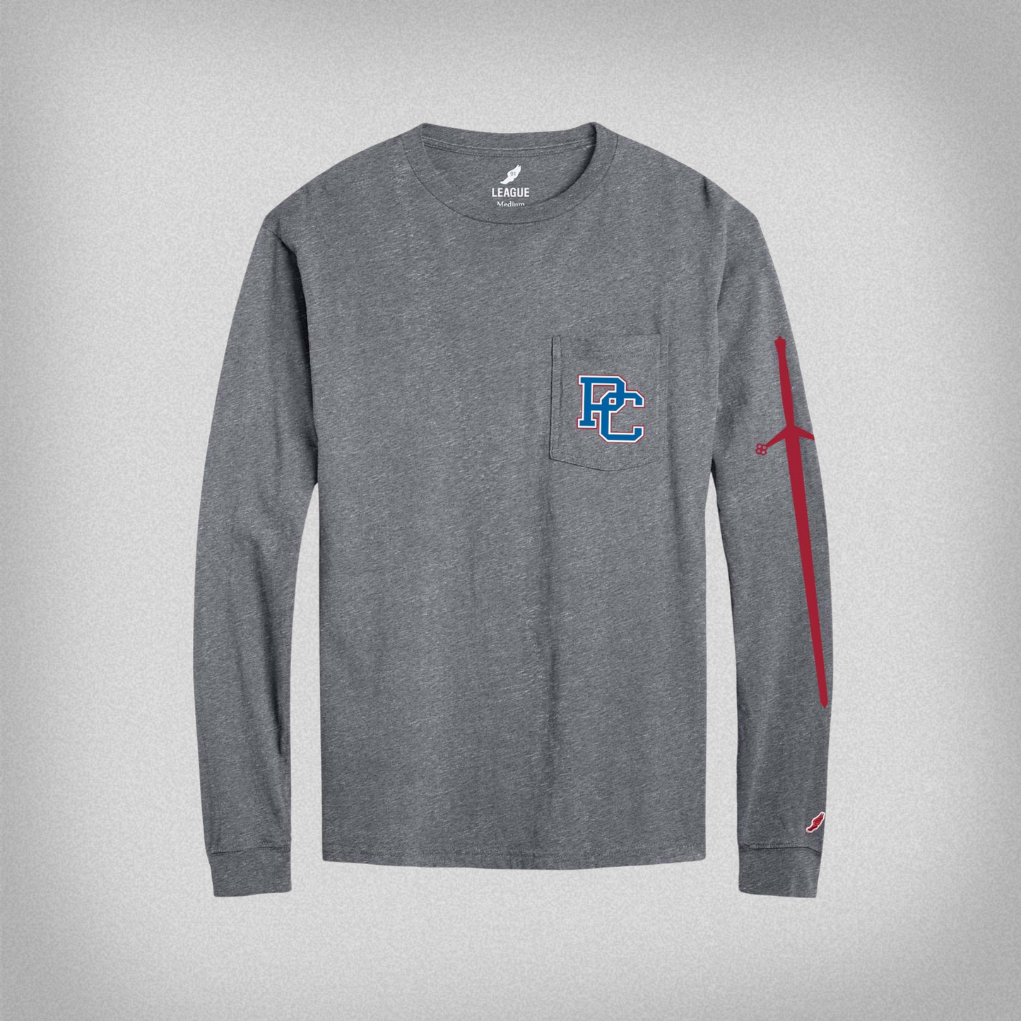 Product photo of a grey long sleeve t shirt with a pocket printed with a 4 color block PC logo on the left front chest and a red broadsword printed down the left sleeve.