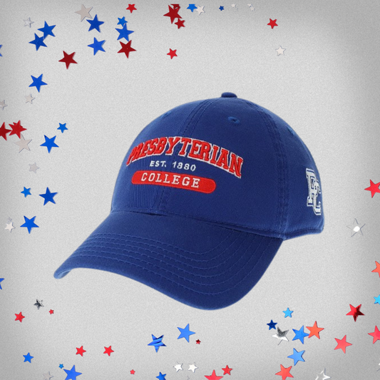 royal blue hat with "Presbyterian College est 1880" embroidered on it in red and white thread with a block PC logo embroidered on the side of the hat. background of the photo has red white and blue stars on it.