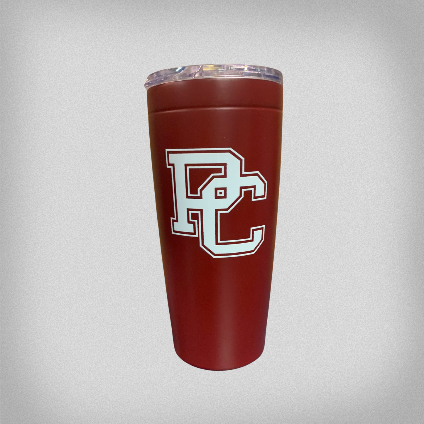 Product phot of a garnet 20 oz tumbler with a white block PC on the front. The tumbler has a clear lid on the top.