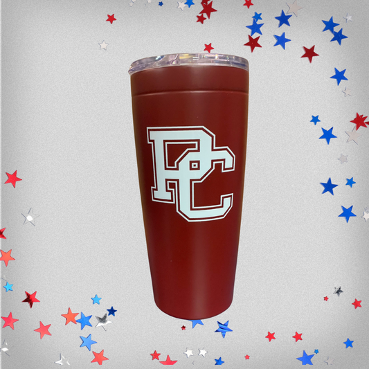 Product phot of a garnet 20 oz tumbler with a white block PC on the front. The tumbler has a clear lid on the top. The background of the product photo has red, white, and blue stars on it.
