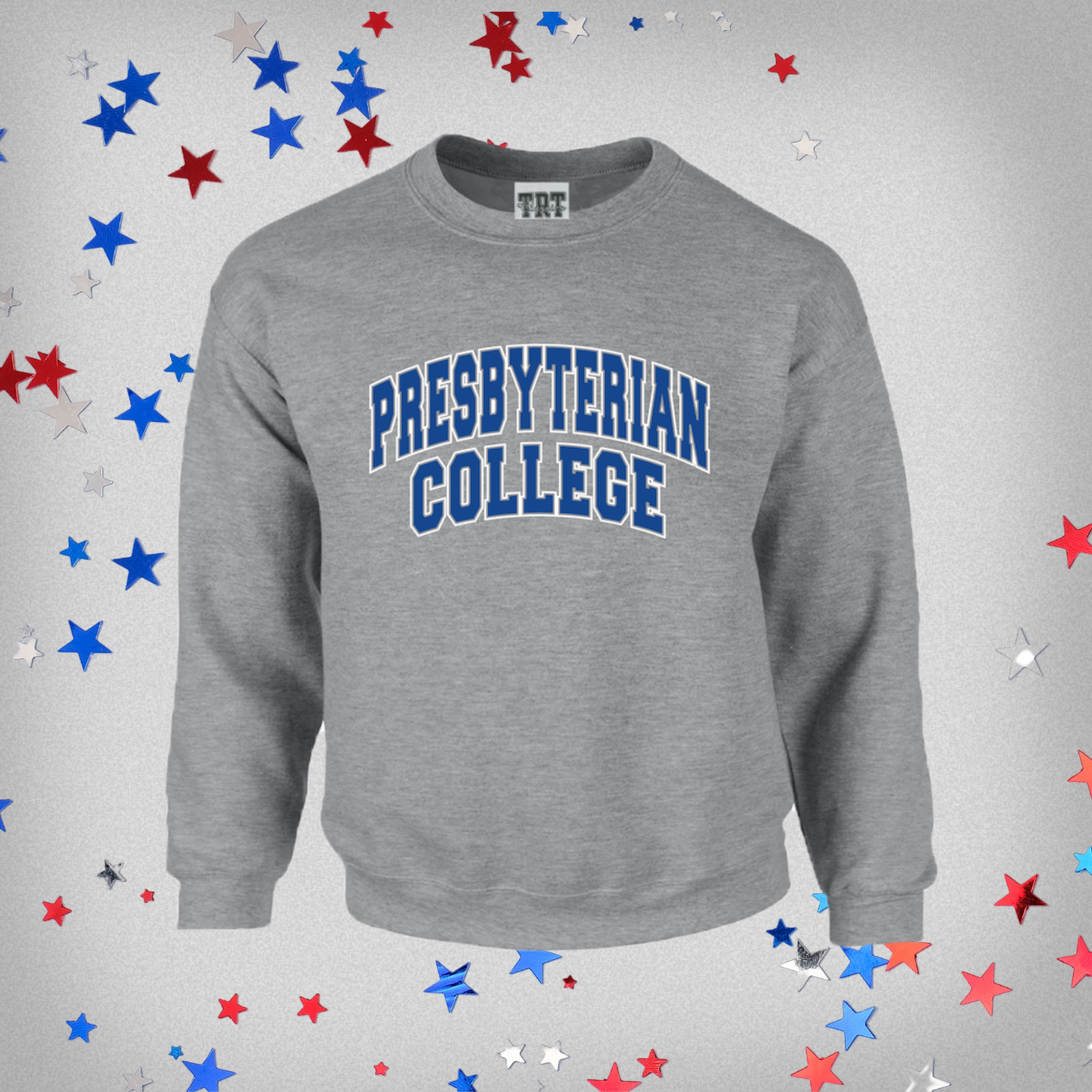 Product phot of a light grey crewneck sweatshirt with "Presbyterian College" printed in royal blue and white ink on the front of the sweatshirt. The product photo has red, white, and blue stars on it.