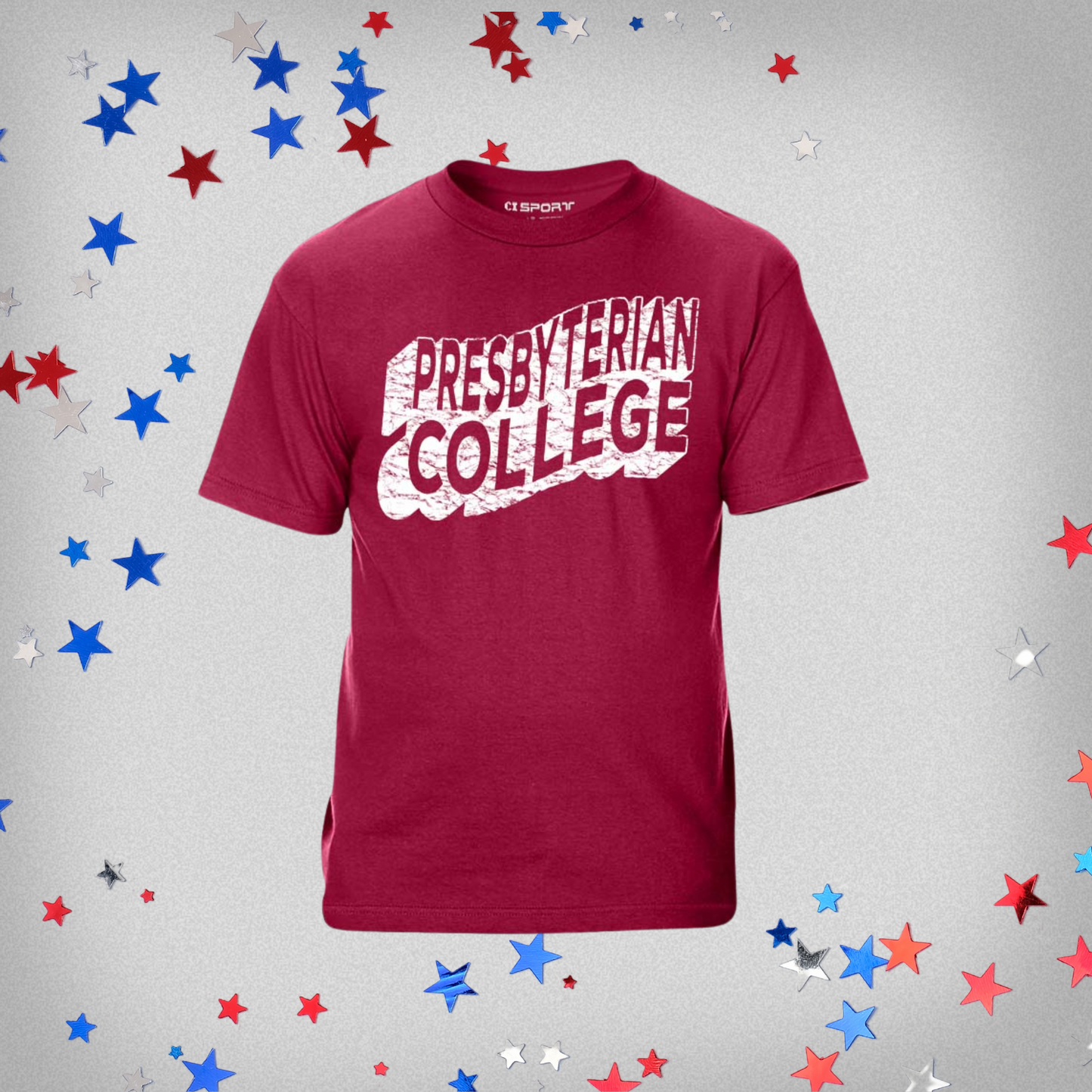 Product photo of a garnet red t-shirt that features a wavy and distressed design in white ink that spells out Presbyterian College. The background of the product photo has red, white, and blue stars on it.