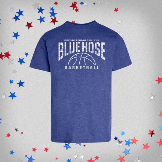 Product Photo of a royal blue heather t-shirt that says Presbyterian College Blue Hose Basketball with a basketball printed on the front of the shirt in white distressed ink. Background of the photo has red, white, and blue stars.