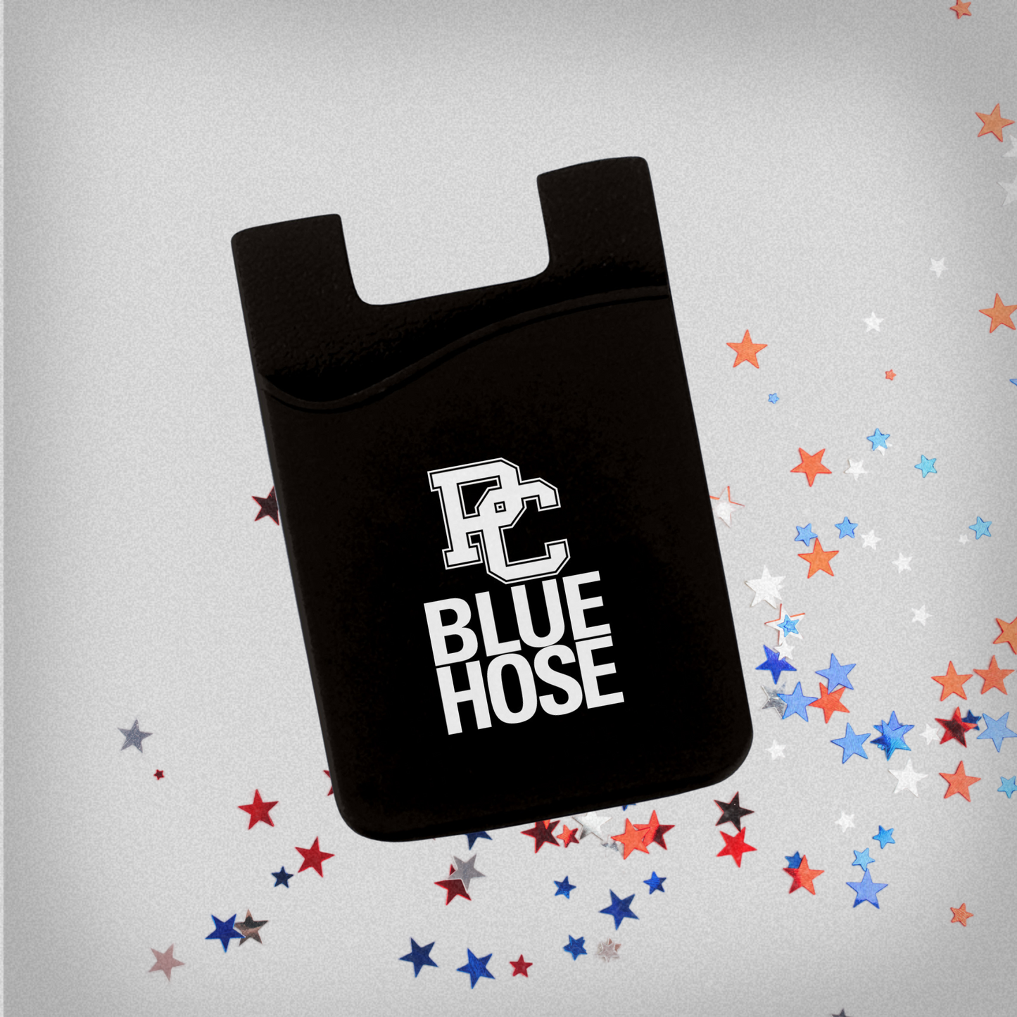 A product photo of a black silicone card holder that sticks to the back of a phone or phone case. The background is grey with red, white, and blue stars.