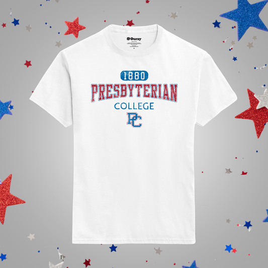 A white short-sleeve t-shirt featuring a red and blue collegiate-style graphic that reads '1880 PRESBYTERIAN COLLEGE' with a 'PC' monogram, displayed against a gray background decorated with red, white, and blue glittery stars.