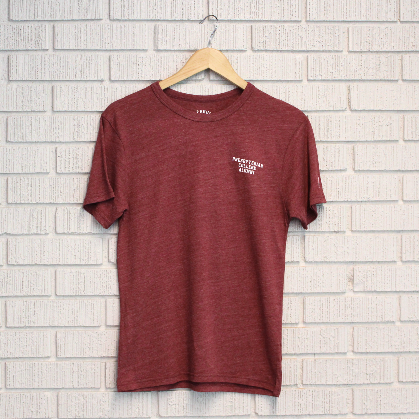 Picture of the front of the garnet alumni tee with Presbyterian College Alumni printed in white ink on the left front chest.