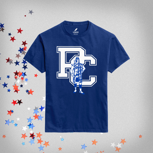 royal blue short sleeve t-shirt with vintage 80s fighting scotsman icon in royal and white ink over the classic Presbyterian College block PC logo. Background of the product has red, white, and blue stars on it.
