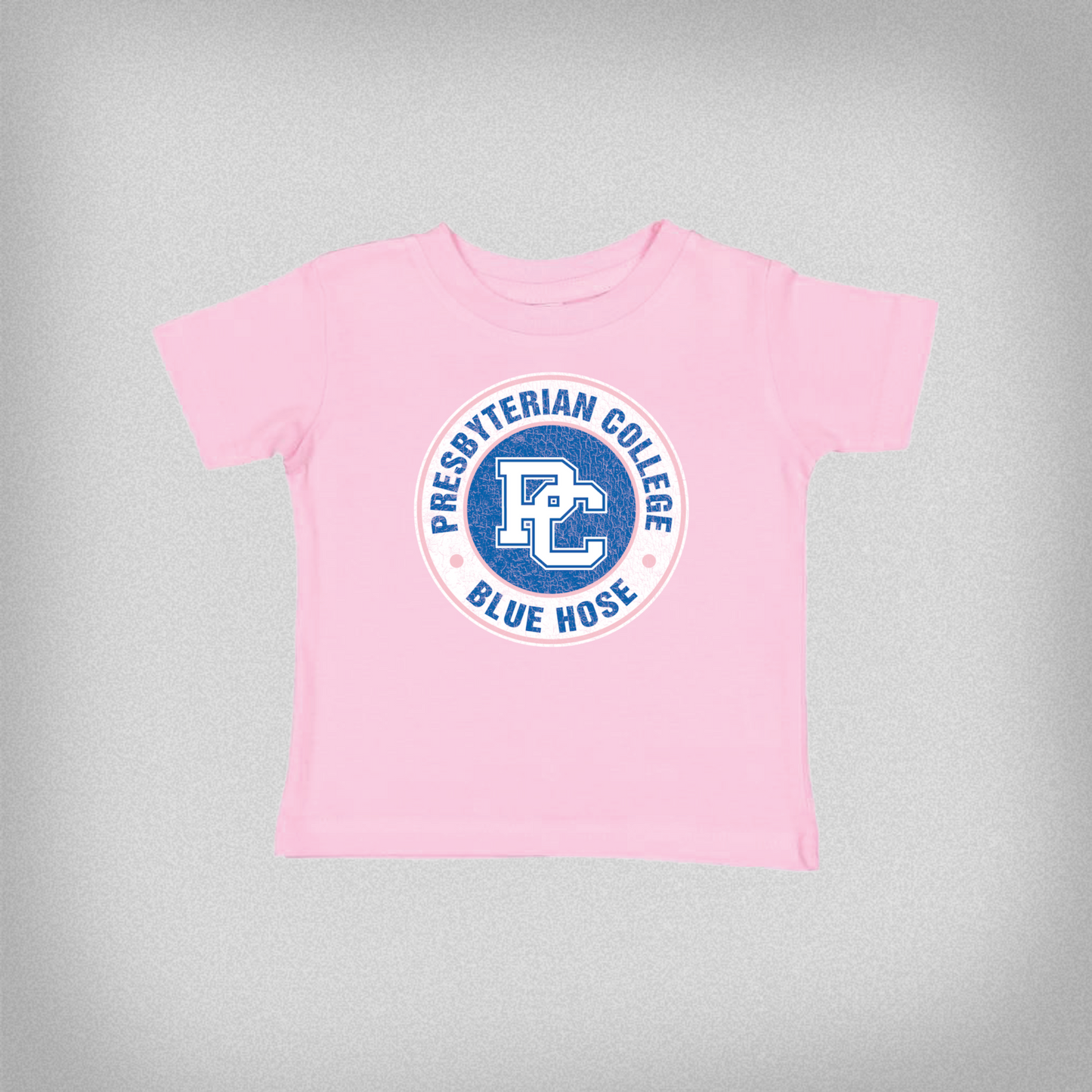 Product photo of a pink toddler t-shirt with a distressed blue and white Presbyterian College design.