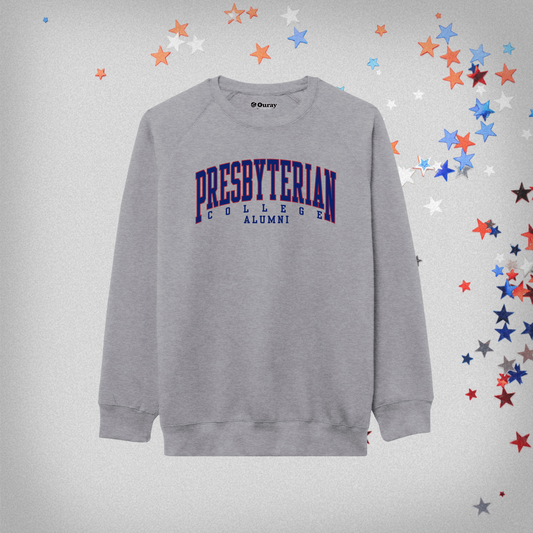 Product photo of a grey sweatshirt with Presbyterian College Alumni printed across the front in royal and red ink. The background of this product photo has red, white, and blue stars on it.