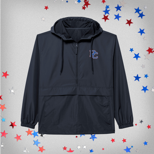 Navy anorak jacket with PC logo on the left front chest. the background of this photo has red, white, and blue stars on it.