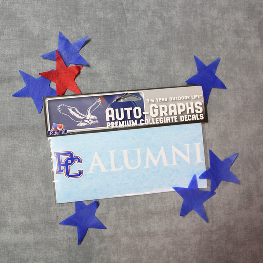 PC Alumni decal. The PC is in blue, red, and white and alumni is in white. There are red and blue stars in the background of this photo.