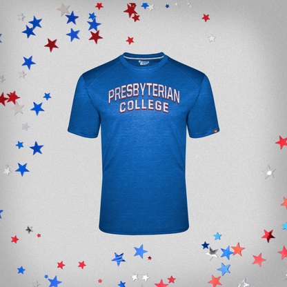 Product photo of a royal blue fit flex t-shirt with a distressed screen print graphic in white and red ink of "Presbyterian College". The background of this product photo has red, white, and blue stars. 
