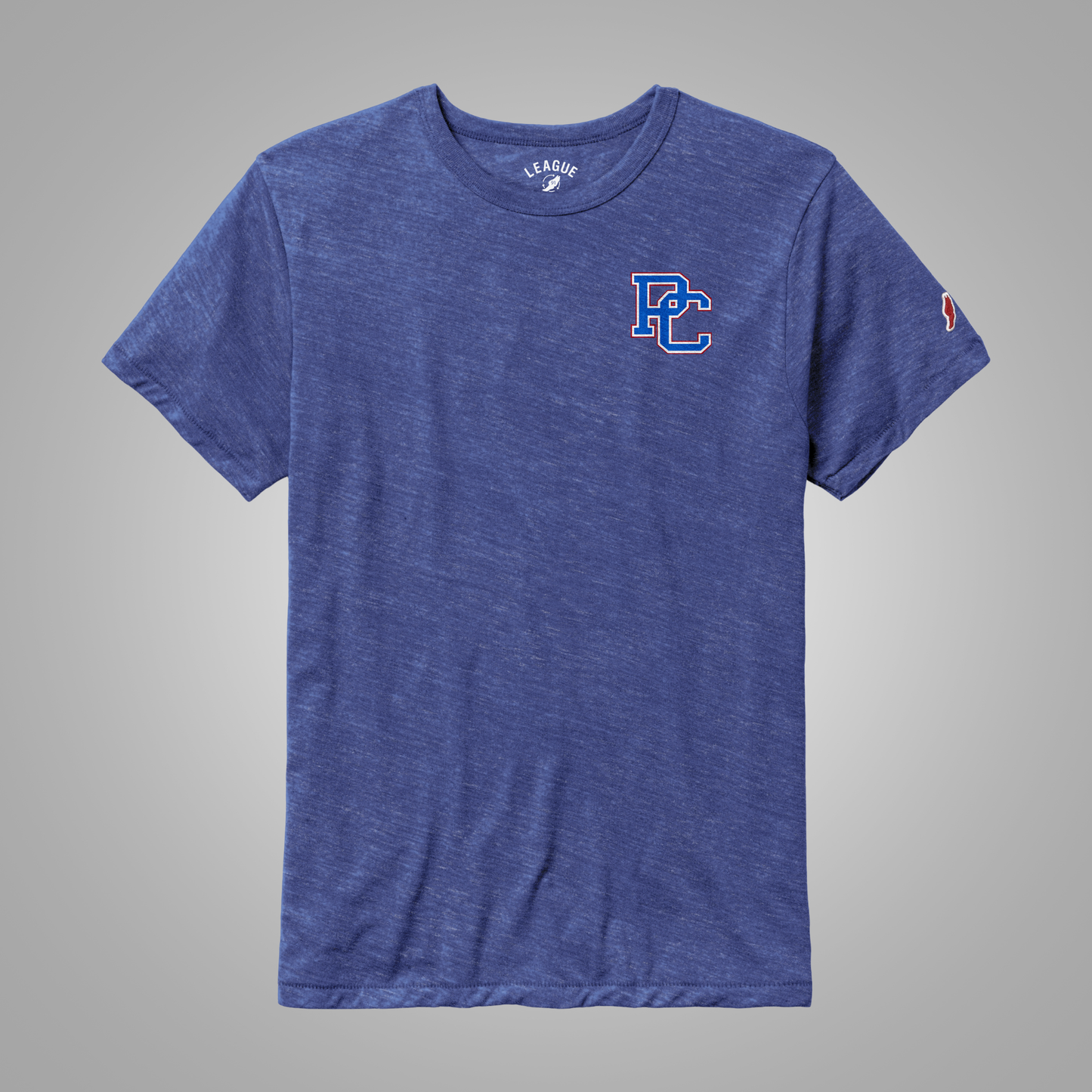 A heathered blue short-sleeve t-shirt with a stylized 'PC' logo in blue and red on the left chest, and a small red, white, and blue logo on the right sleeve. The shirt is displayed flat against a neutral gray background.