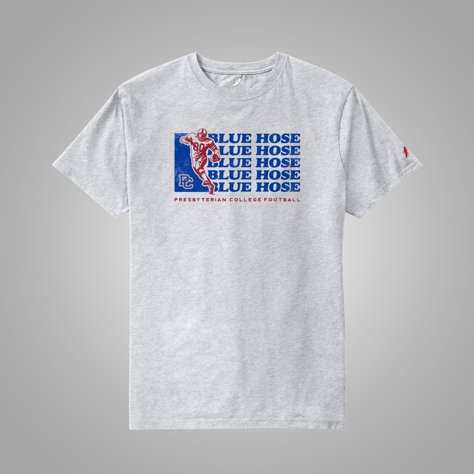 An ash t-shirt featuring a blue and red graphic print on the front that reads 'BLUE HOSE' with a football player silhouette and 'PRESBYTERIAN COLLEGE FOOTBALL' underneath.