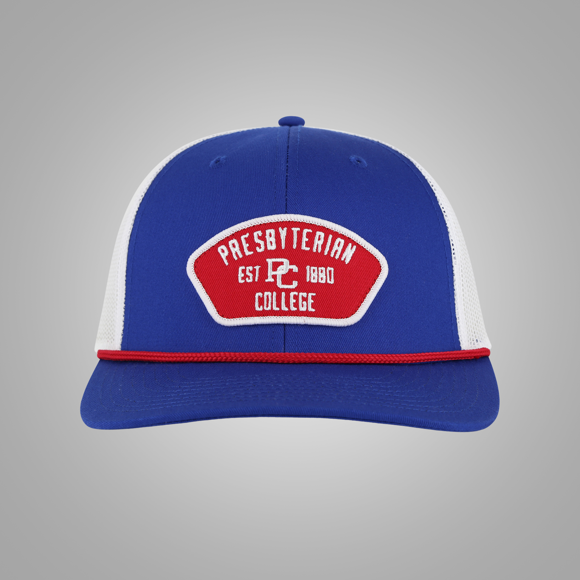 A royal blue and white trucker-style baseball cap with a red and white embroidered patch on the front reading 'Presbyterian Est PC 1880 College'.
