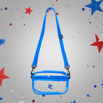 Clear sling crossbody bag with adjustable straps and royal blue accent colors and a PC logo on the front