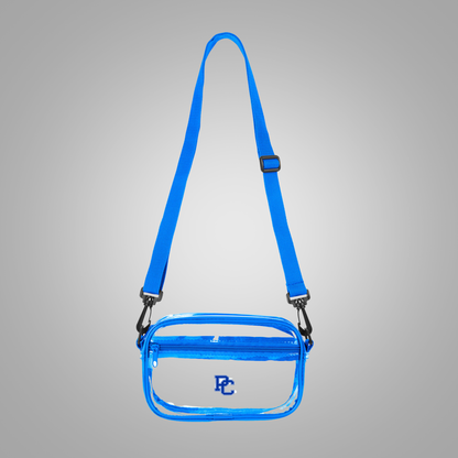 Clear sling crossbody bag with adjustable straps and royal blue accent colors and a PC logo on the front