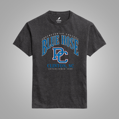 A dark heather black t-shirt with a blue and white graphic print on the front reading 'Presbyterian College Blue Hose Clinton, SC'. The shirt is displayed against a neutral gray background.