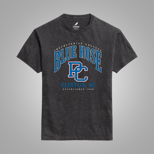 A dark heather black t-shirt with a blue and white graphic print on the front reading 'Presbyterian College Blue Hose Clinton, SC'. The shirt is displayed against a neutral gray background.
