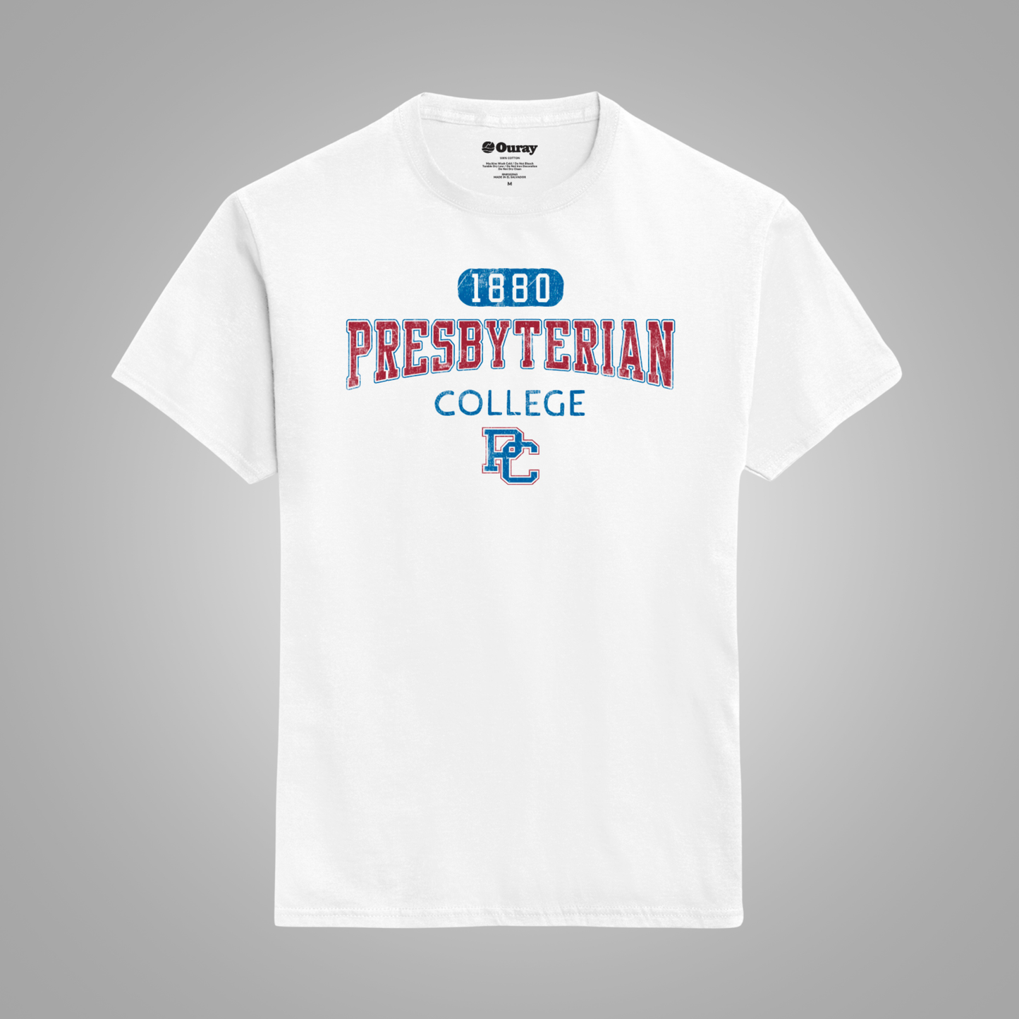 A white short-sleeve t-shirt with a collegiate-style graphic on the chest reading '1880 PRESBYTERIAN COLLEGE' in red and blue, with a blue 'PC' monogram, shown on a neutral gray background.