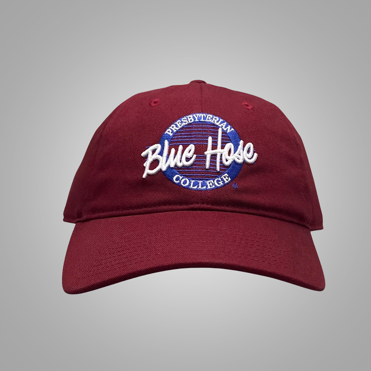 A maroon baseball cap featuring an embroidered 'Presbyterian Blue Hose College' logo on the front, set against a neutral gray background.