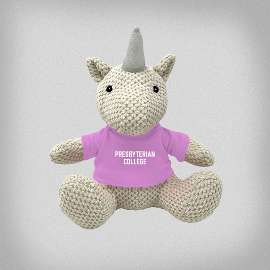 Plush unicorn toy wearing a pink 'Presbyterian College' t-shirt on a gray background