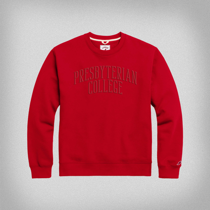 Red crewneck sweatshirt with Presbyterian College embroidered in red thread across the front in a slight arch.
