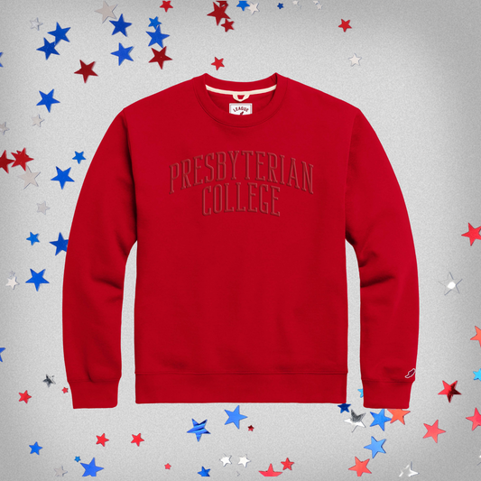 Red crewneck sweatshirt with Presbyterian College embroidered in red thread across the front in a slight arch.
