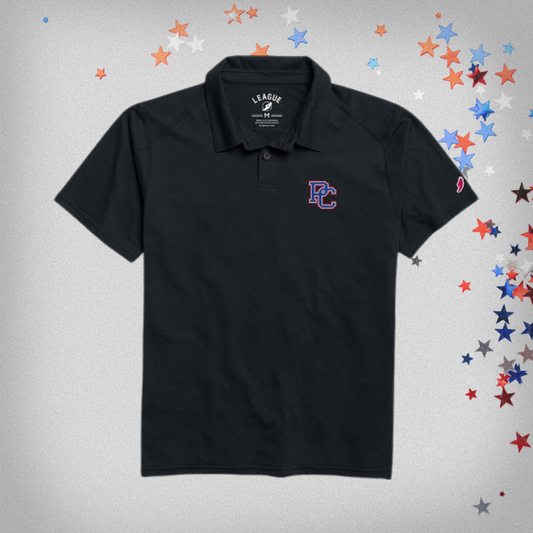 Navy polo shirt with embroidered PC logo on front left chest. background photo has star confetti