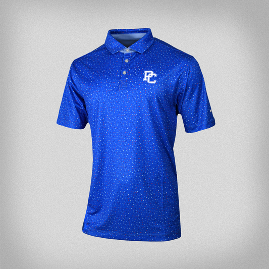 Hyper blue columbia polo with red and white confetti pattern all over it, and an embroidered white block PC logo on the front left chest.