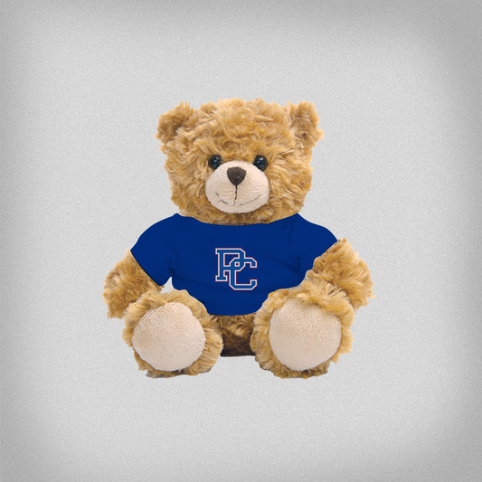 Plush light brown teddy bear wearing a blue shirt with a block PC logo