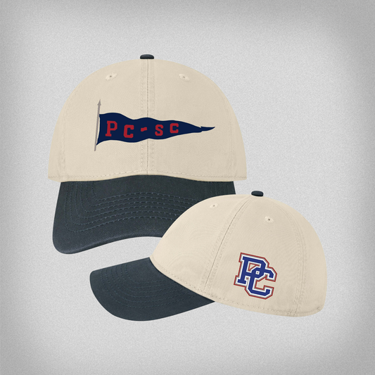 Khaki and navy cap with embroidered vintage PC-SC flag on the front and side view of the same hat with a block PC logo on the side pictured on a light gray background