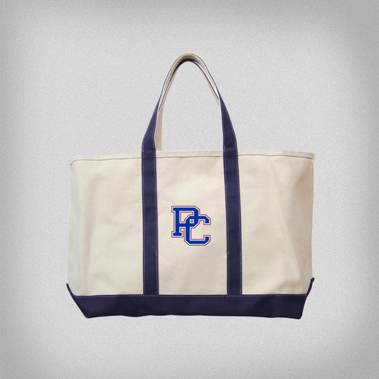 Canvas tote with embroidered PC logo in the middle. Straps and bottom of tote are navy blue
